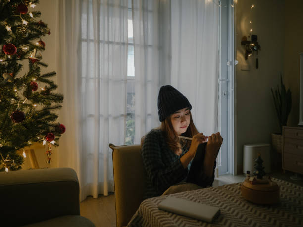 istock Asian freelancer work from home in Christmas holiday. 1308899497