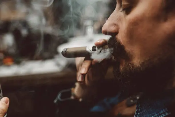 Portrait of an attractive business man with a cigar