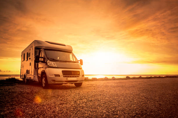 istock Motorhome at sunset on the beach 1308901299