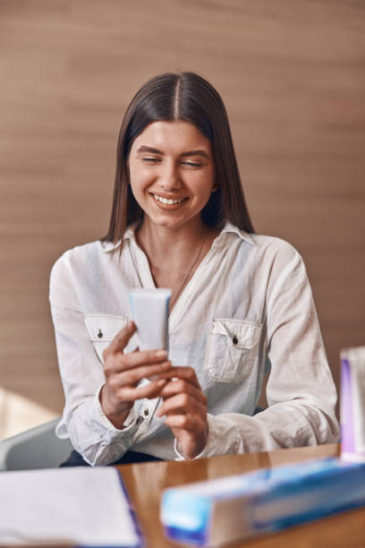 istock Happy beautiful caucasian woman with toothpaste in modern clinic's reception 1308905369
