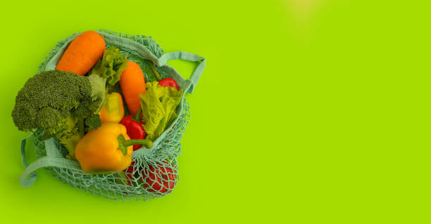 istock fresh vegetables in an eco bag on a colored background 1308907120