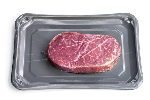istock Raw beef fillet steak in vacuum package isolated on white 1308907552