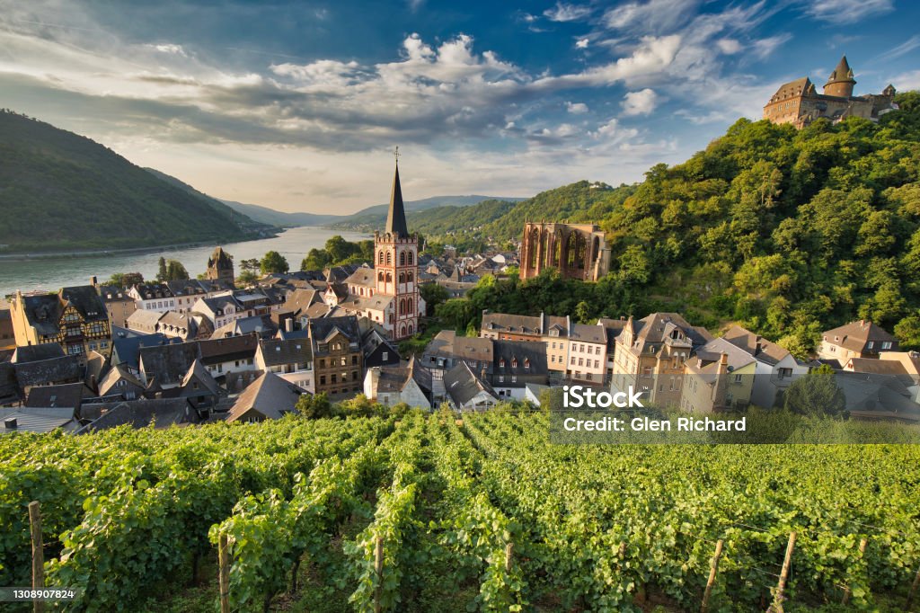 Bacharach, Germany A view of Bacharach, Germany from the old town wall as the early sun is just lighting up the valley on a beautiful day. Germany Stock Photo
