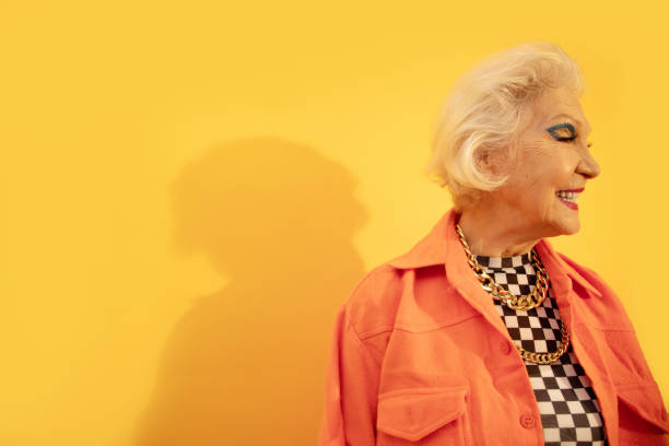 istock Woman with bright make up and toothy smile looking away while feeling happy 1308910263