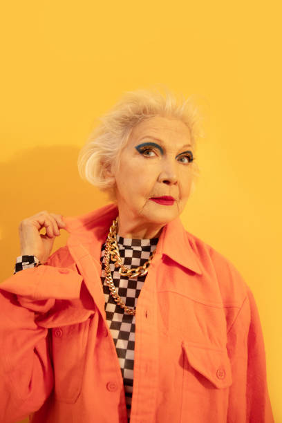 istock Woman posing at the studio with yellow wall at the background 1308910283