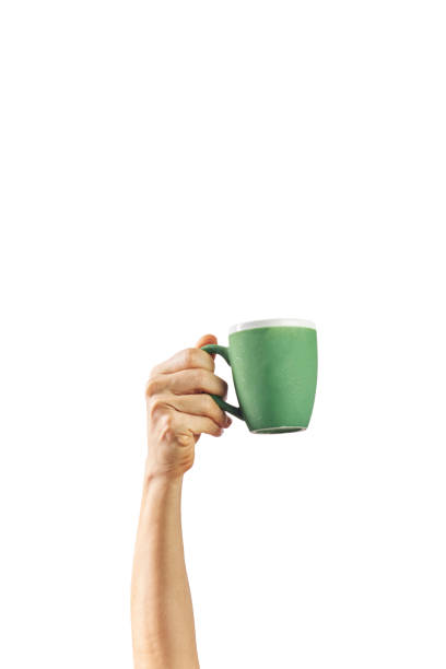 istock Female hand mockup holding breakfast cup isolated on white background. 1308911576