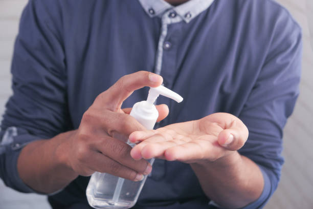 istock Using sanitizer liquid for preventing corona virus 1308911798
