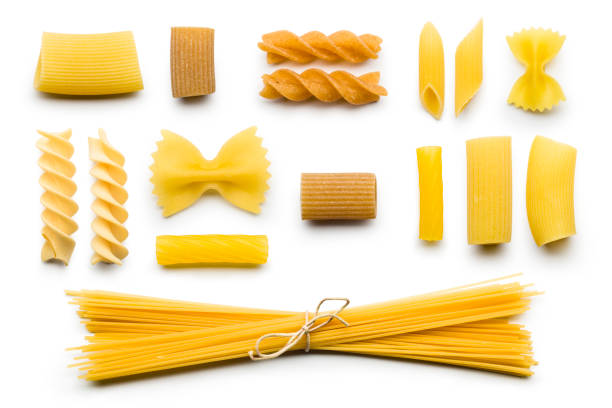 variety of pasta Top view of variety uncooked pasta on white background pasta stock pictures, royalty-free photos & images