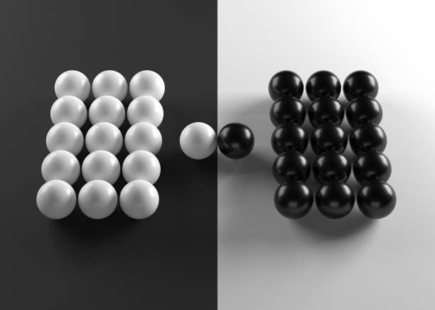 istock Group of black and white spheres confronting each other 1308914462