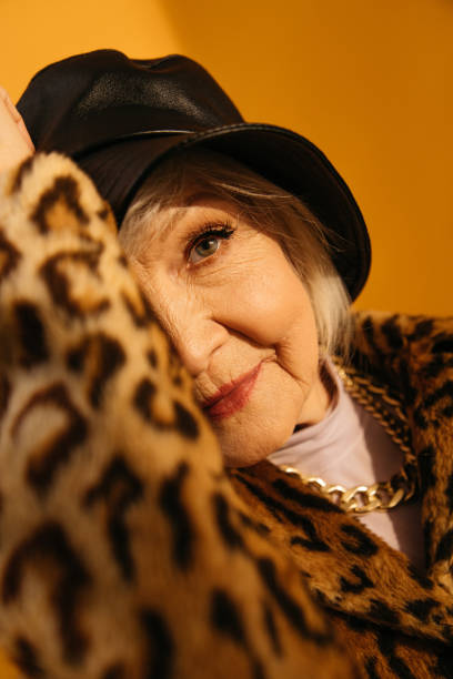 istock Aged woman smiles while being happy to spend free time at the studio 1308914720