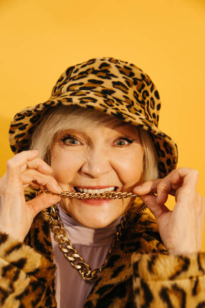 istock Woman bites her neck chain while looking at the camera with funny emotions 1308915261