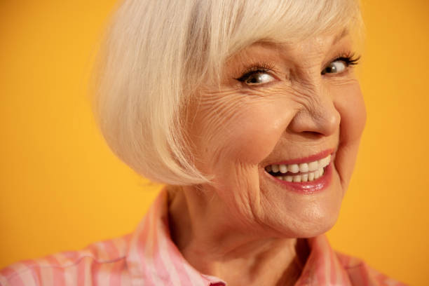 istock Elderly woman smiling widely, while being in happy mood 1308915321