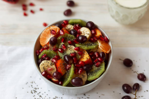istock Fruit vitamin salad in a bowl on a light background 1308916384