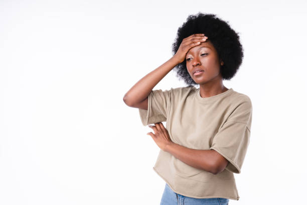 istock Tired exhausted african girl isolated over white background 1308918802
