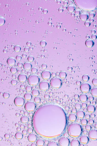 istock oil with bubbles on coral background. Pink Abstract space background. Soft selective focus. macro of oil drops on water surface. copy space. air bubbles in water, 1308922048