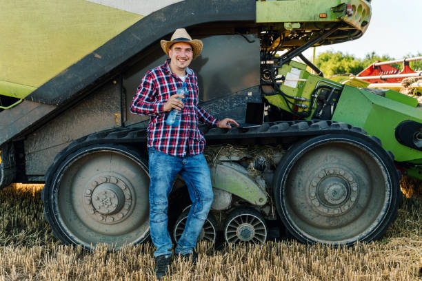 istock A farmer rests during the harvest, drinking water 1308926520