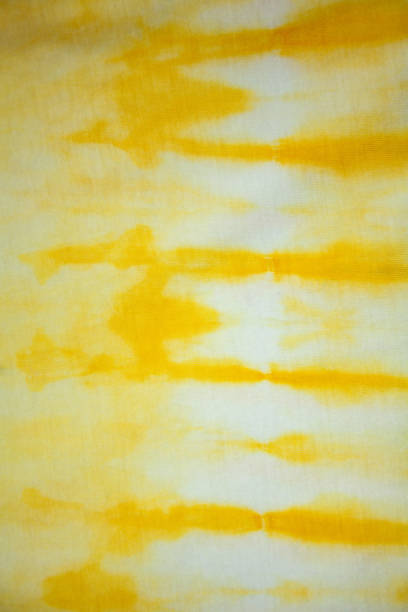 istock Tie Dye back ground .Yelow and white,strips drawing with paints 1308928612