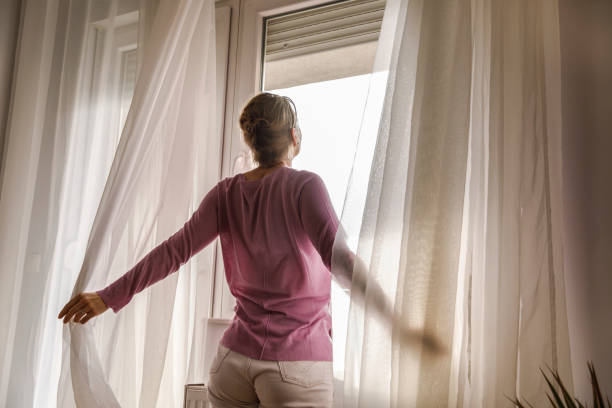 istock Feeling free and daydreaming while looking outside the window 1308933612
