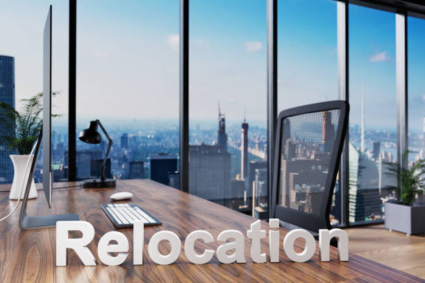 istock architect; office chair in front of modern workspace with computer and skyline view; relocation company concept; 3D Illustration 1308933741