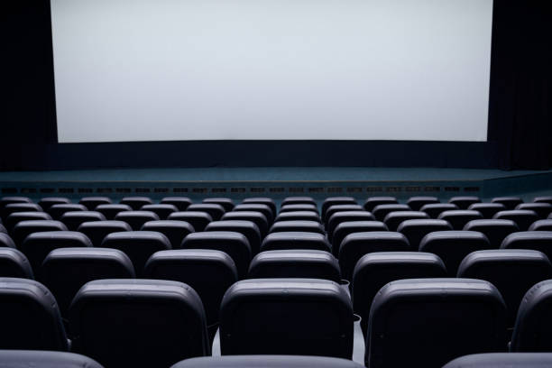 istock Rows of theater seats and white screen. 1308936984