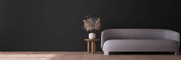 istock Modern dark living room design, beige minimal sofa on empty black wall mock up, panorama 1308937045