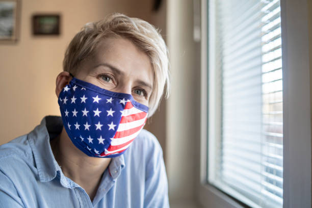 istock Woman dressed in a  USA flag face mask 1308943841
