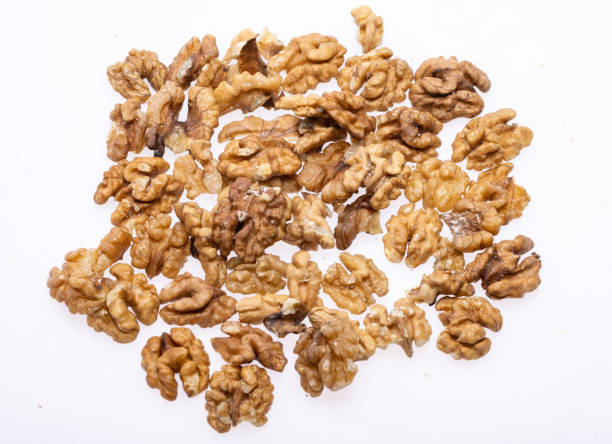istock Shelled Walnuts Pile Top View Isolated On White Background 1308947814