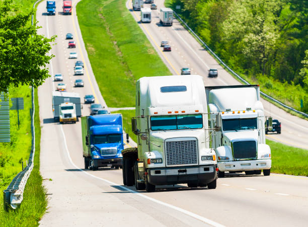 istock Tractor Trailer Rigs Lead Traffic Up A Tennessee Interstate Incline REVISED 1308950893