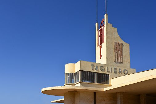 Asmara, Eritrea: the iconic art deco Fiat Tagliero Building - a futurist, aviation inspired service station completed in 1938 and designed by the Piedmontese civil engineer Giuseppe Pettazzi - a central fuselage with glass cockpit (the office and the shop) a cantilevered, reinforced concrete wings, each 15m long - a symbol of technological avant-garde - intersection of Sematat Avenue and Mereb Street - Asmara: a modernist city of Africa, Unesco World Heritage Site.
