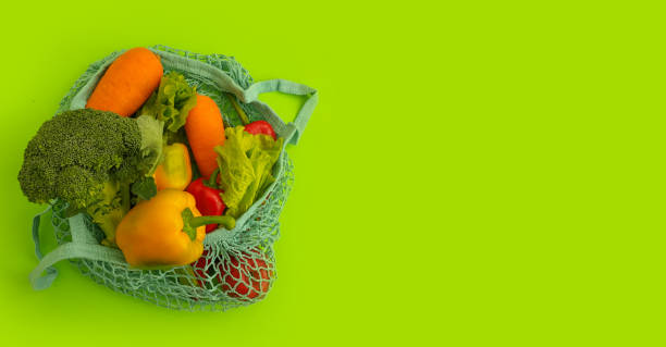 istock fresh vegetables in an eco bag on a colored background 1308953052