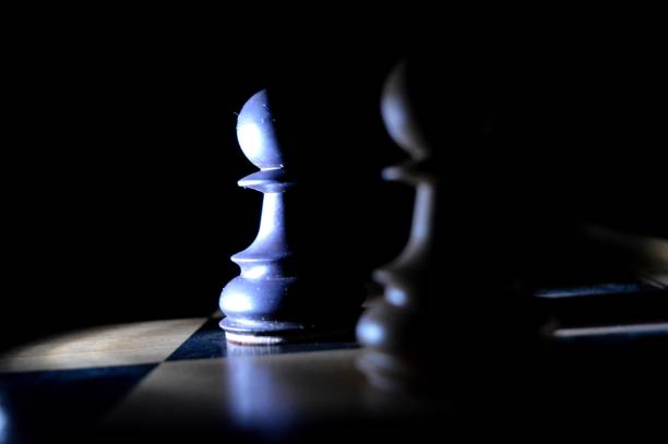 istock chess pieces illuminated in the dark 1308953209