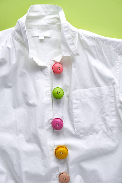 istock Colorful mini macarons on white shirt imitating buttons 1308953368