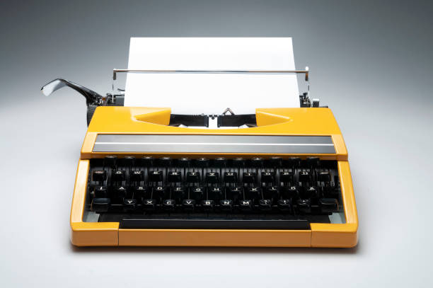 istock Like New Condition Vintage Yellow Typewriter on White Board 1308955214