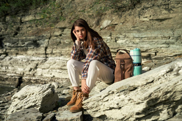 istock Adorable brunette sitting on stone at Bakota bay 1308956988