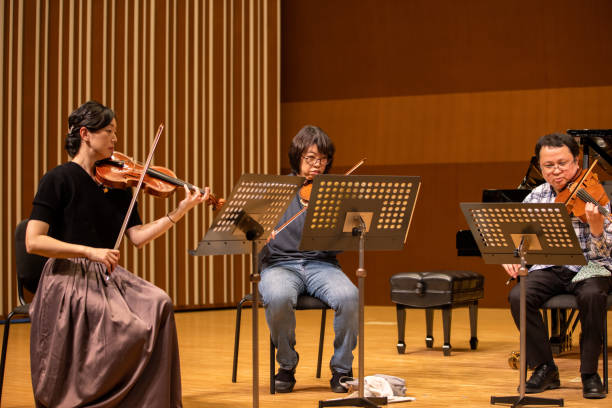 istock Musicians playing violin and viola at classical music concert 1308959243