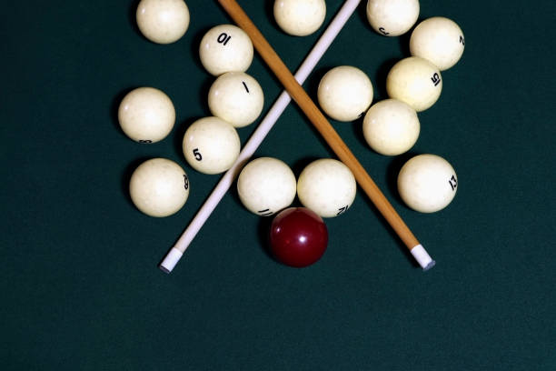 istock Billiard table with balls, cue, triangle. Green cloth. Playing billiard and pool. Ruusian billiard 1308960110