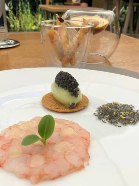 Fine dining, creative dish with 3 different prawns preparations served in michelin star restaurant