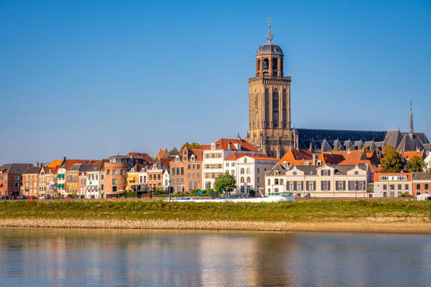 river ijssel and the dutch hanze city of deventer (netherlands) - grass church flood landscape imagens e fotografias de stock