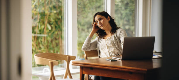 istock Woman thinking of some ideas while working from home 1308961904