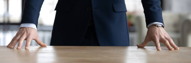 istock Horizontal banner close up confident businessman standing at office desk 1308963257