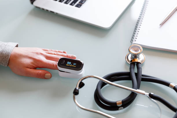 istock Female patient hand measuring oxygen saturation and pulse using portable oximeter. 1308963978