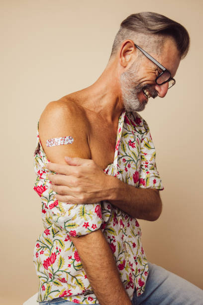 istock Mature man after getting covid-19 vaccine 1308967065