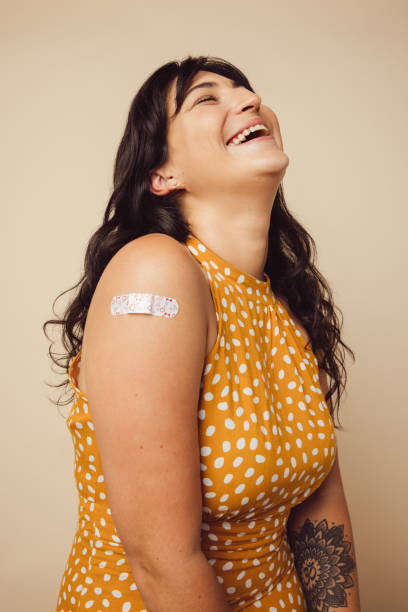 istock Woman smiling after getting immunity vaccine 1308967294