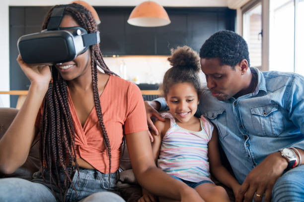 istock Family playing video games with VR glasses. 1308968711