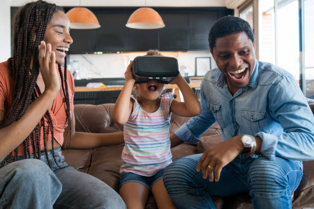 istock Family playing video games with VR glasses. 1308968714