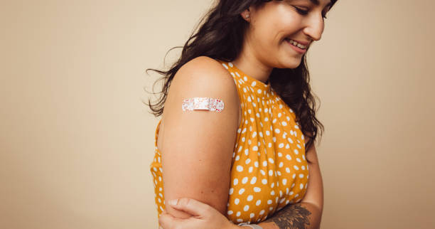 istock Woman received vaccination on her arm 1308968719