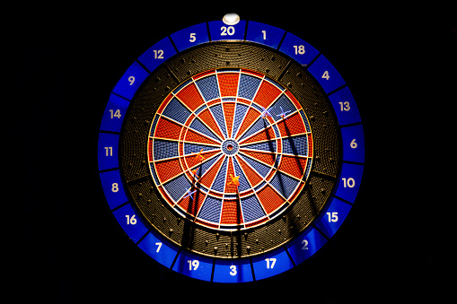 Dartboard isolated on black background