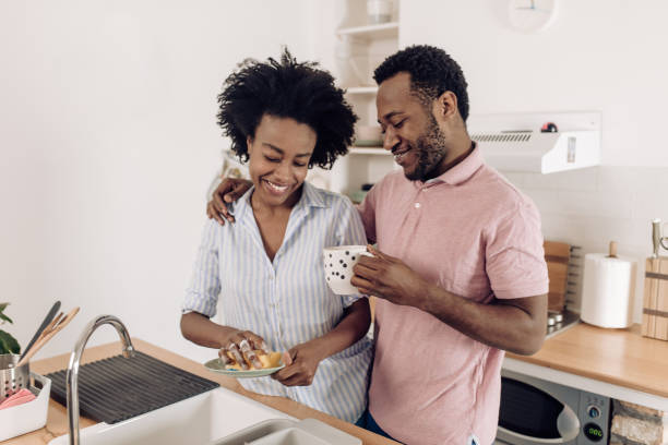 istock African American woman and her husband enjoying while doing housework 1308969986