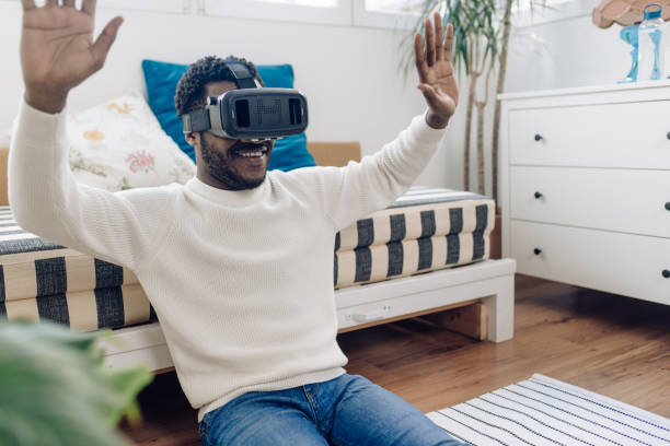istock Excited young man having fun with 3d glasses at home 1308970022