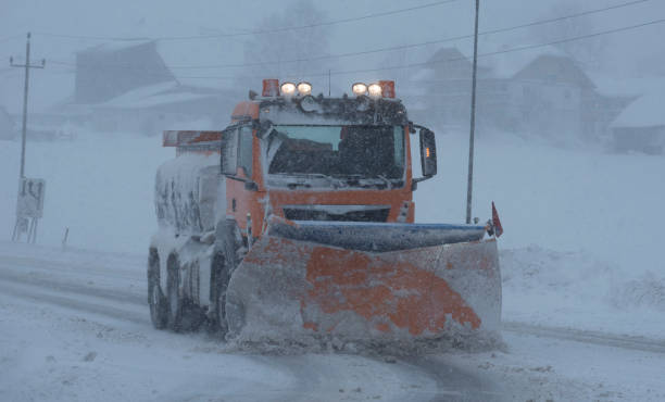 istock snow plow on country road 1308971540
